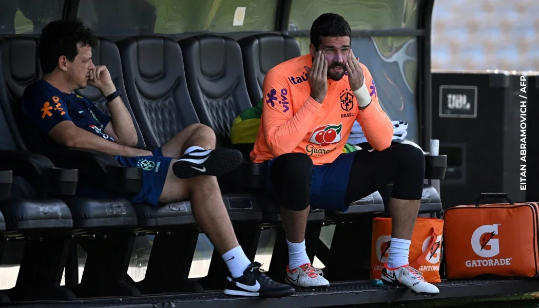 Alisson Becker y Fernando Diniz.