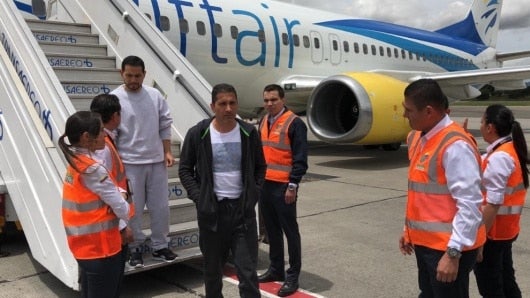 Juan Carlos Ramírez Taborda, alias Manicomio, y el abogado Leonardo Pinilla, alias Porcino.