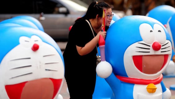 Fans del gato cósmico en China. Foto: AFP