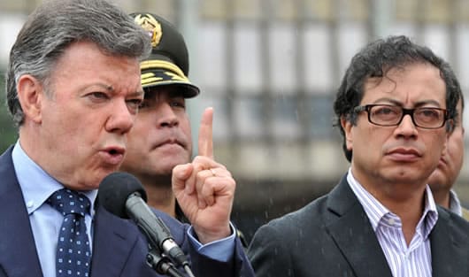 El presidente Juan Manuel Santos y el alcalde Gustavo Petro. Foto: AFP.