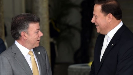 Juan Manuel Santos y Juan Carlos Varela. Foto: AFP