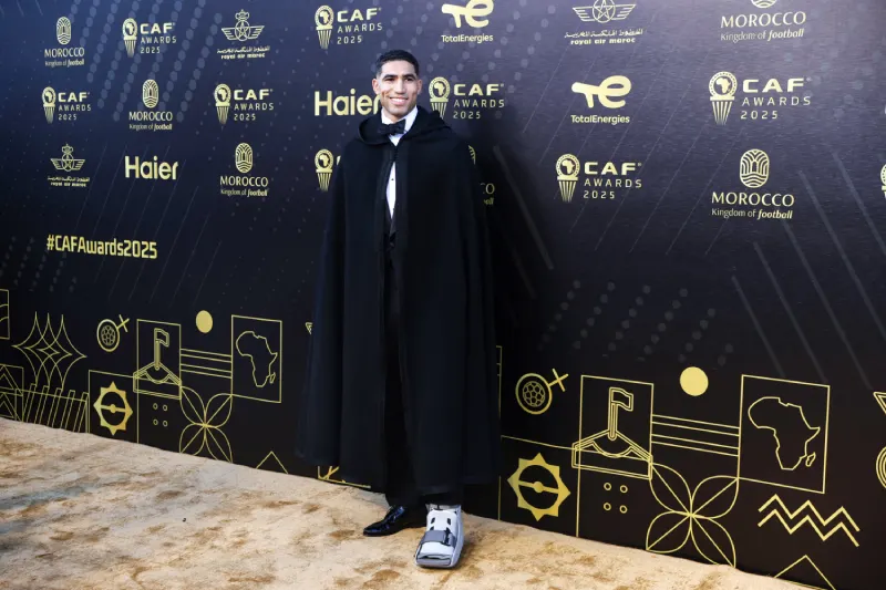 Paris Saint-Germain's Moroccan defender Achraf Hakimi poses for a picture as he arrives for the 2025 Confederation of African Football (CAF) Awards in Sale, Morocco on November 19, 2025.