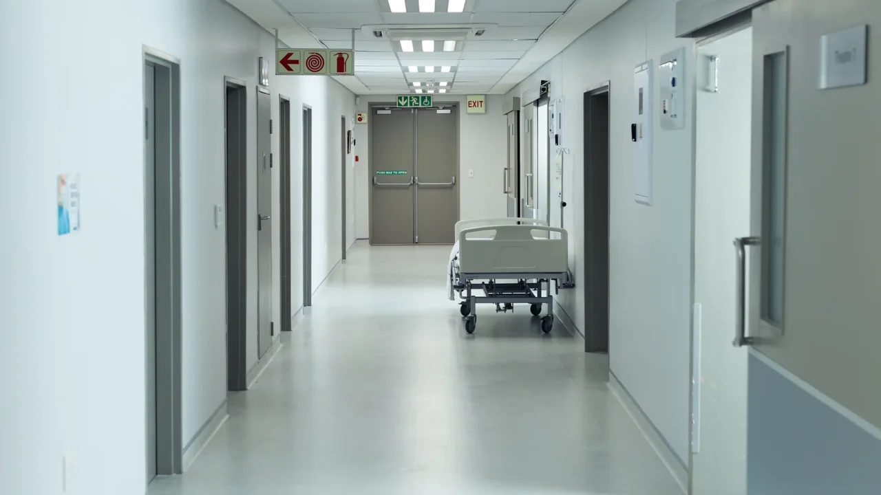 She's been hospitalized for two months, was discharged, but can't go home because she hasn't been assigned a home nurse