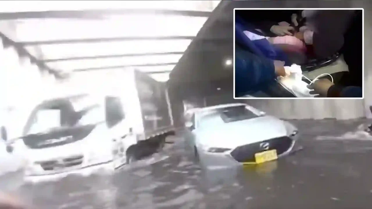 Video of the distressing rescue of a baby and her mother trapped in a car in the depression of the 94th street